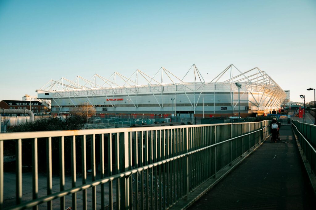 View of St Mary's Stadium in Southampton during sunset with a clear sky.